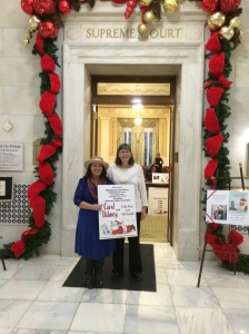Carol Dabney and Cindy Reyes reading Twas the Mouse Before Christmas in English and Spanish. Book and Mouse available at the capital gift shop  in Little Rock till Dec 17, 2014
